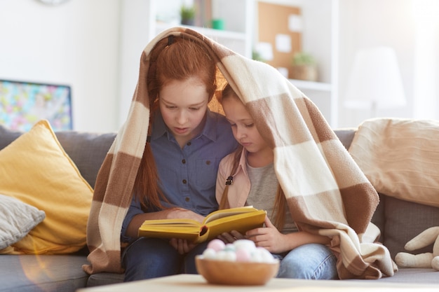 Two Sisters Reading Book