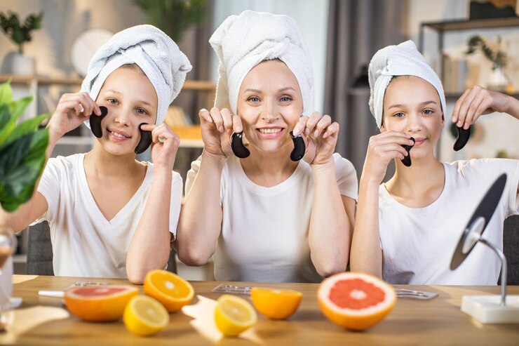Photo two sisters and their mother holding collagen patches