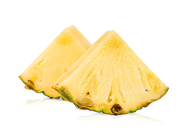 Two sliced pineapple wedges on white isolated