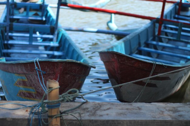 Two small boats on the bank of the river