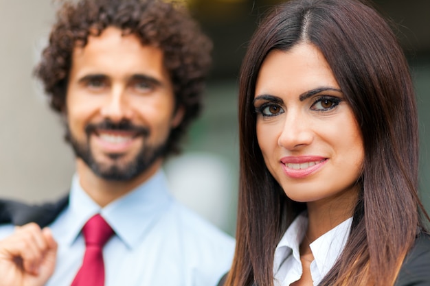 Two smiling business people