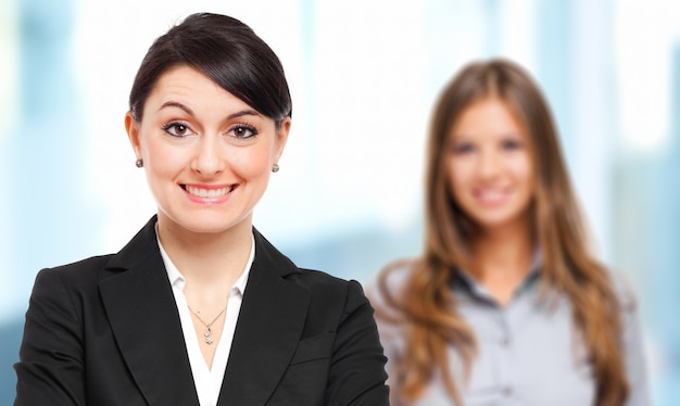 Two smiling business woman