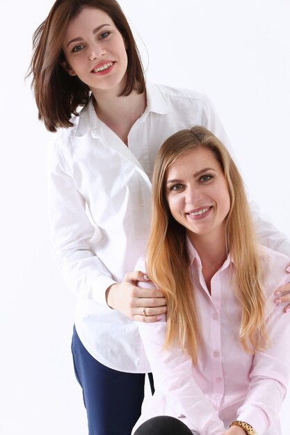 Two smiling happy joyful female friends portrait looking in camera. Homosexual marriage, lesbian couple, love relations, modern positive relationship concept