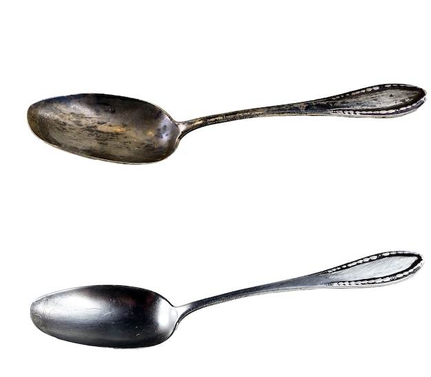 two spoons that have rust on them