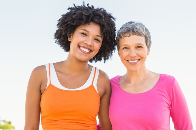 Two sporty women smiling at camera