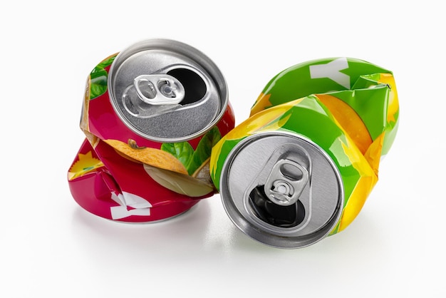 Two squeezed soda cans isolated on a white background Recycling and recycling concept