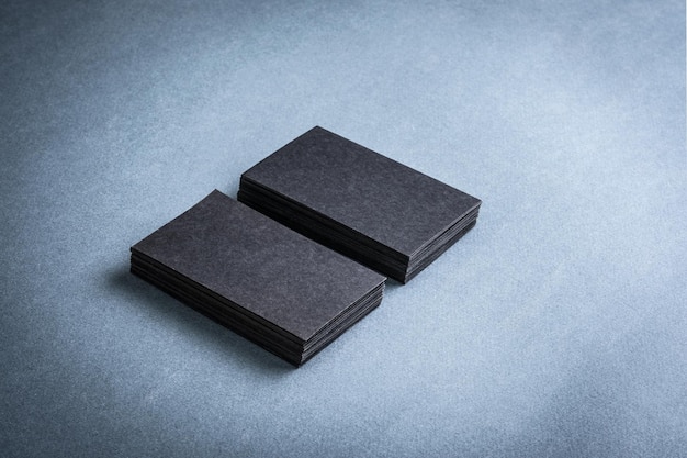 Two stacks of black blank business cards mockup for branding identity