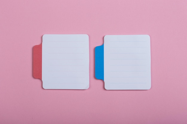 Two sticky note on pink background Copy space