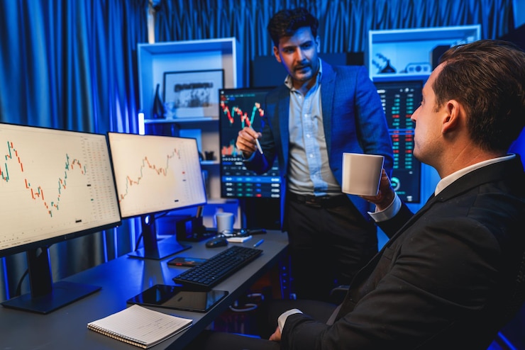 Photo two stock exchange traders discussing dynamic investment graph sellable