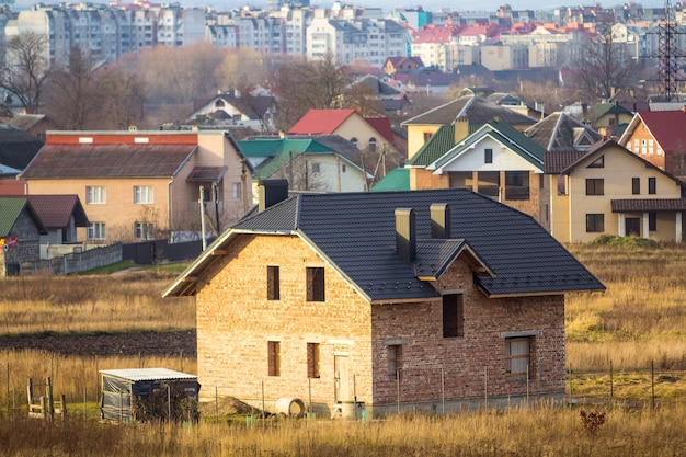 Two storey residential house under construction with city view behind