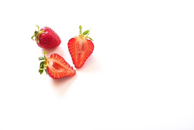 Two strawberries isolated on white background inside view Sliced strawberries half a berry