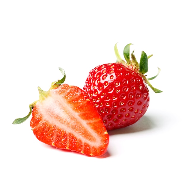 Two strawberries with strawberry leaf on white background