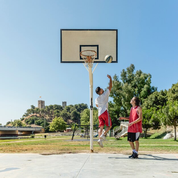 Two street player playing basketball