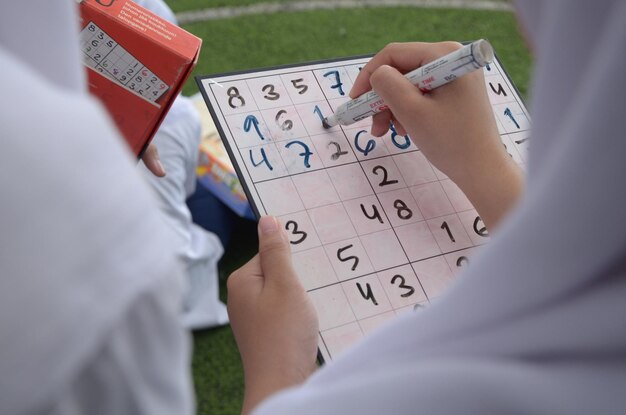 Two students are playing guessing numbers