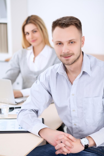 Two successful business partners working at meeting in office Focus on man