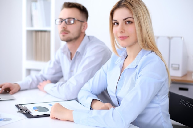 Two successful business partners working at meeting in office.