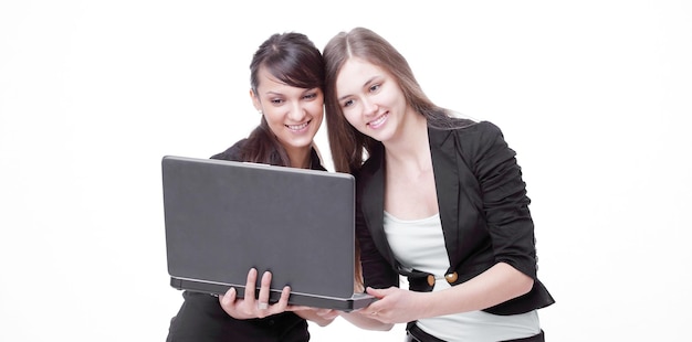 Two successful employees looking at laptop screen