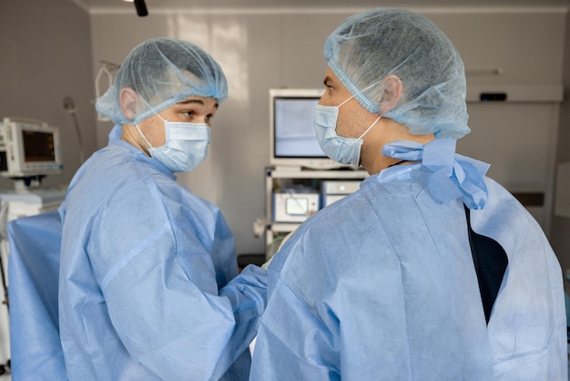 Two surgeons operating a patient with endoscopes
