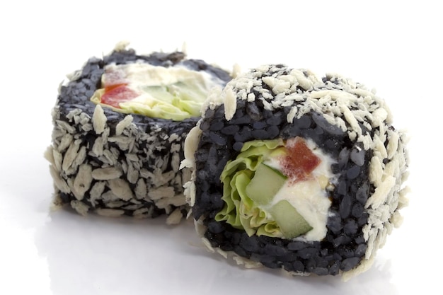 Two sushi with black rice closeup