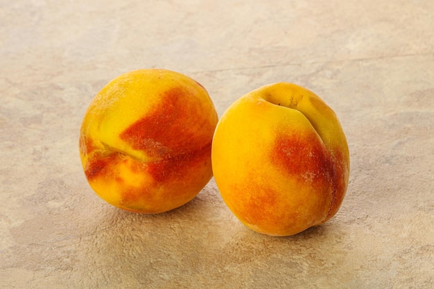 Two Sweet ripe tasty peaches