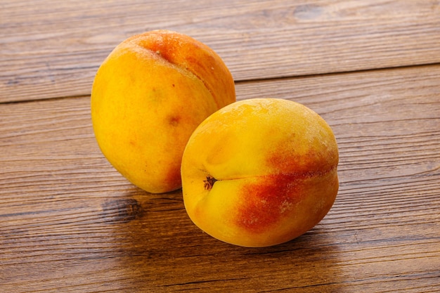 Two Sweet ripe tasty peaches