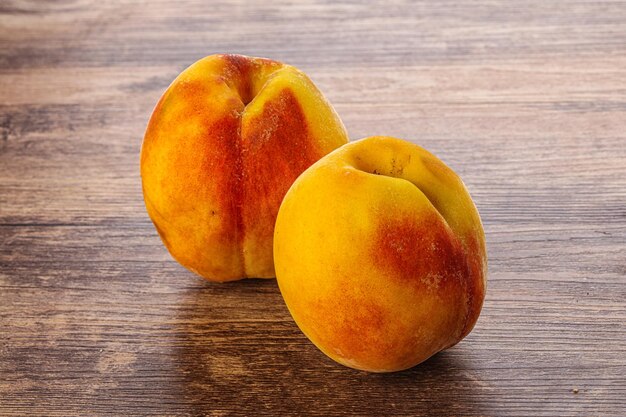 Two Sweet ripe tasty peaches