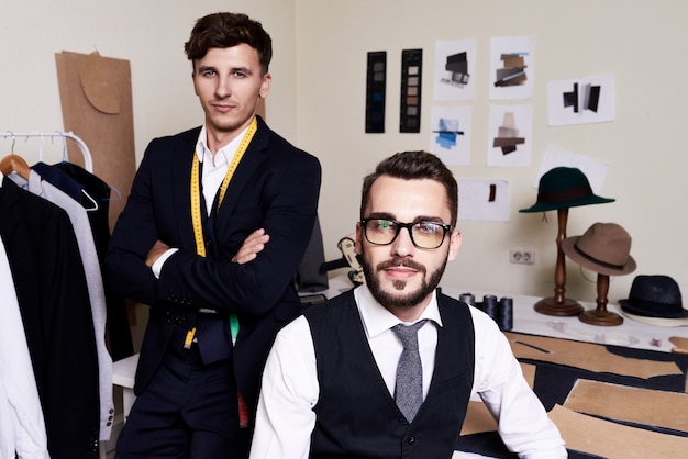 Two Tailors Posing in Atelier