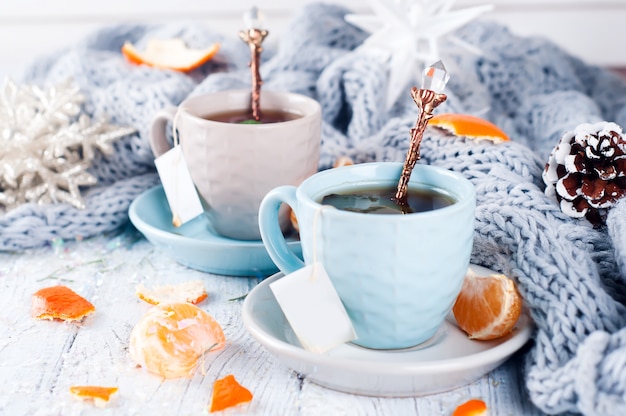 Two tea cups with teabag and xmas tree