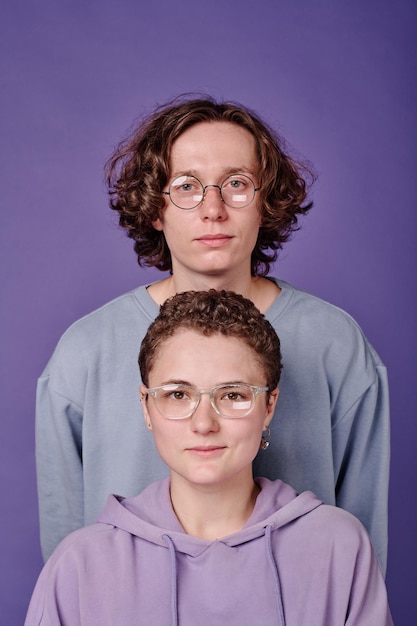 Two teenagers wearing eyeglasses for sight