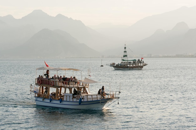 Two tourist boats at sea