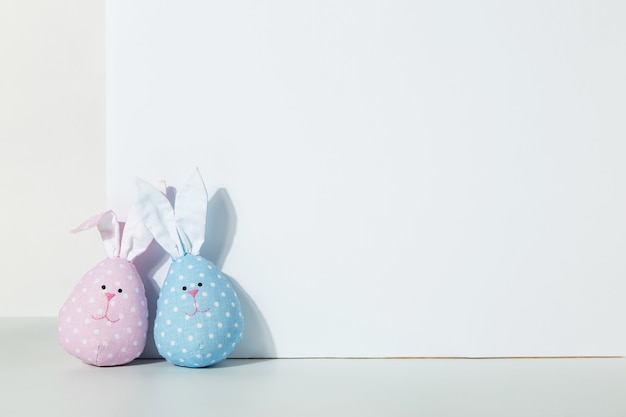 Two toys rabbits made with their own hands pink and blue