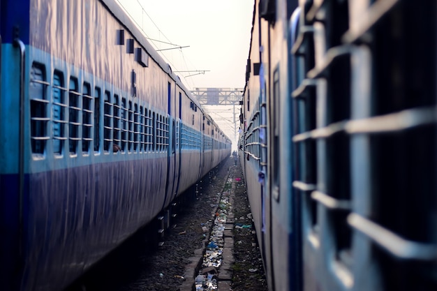 two  trains perspective on railway track