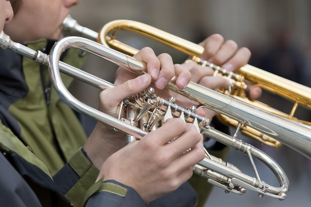 Two tubes in the hands of musicians