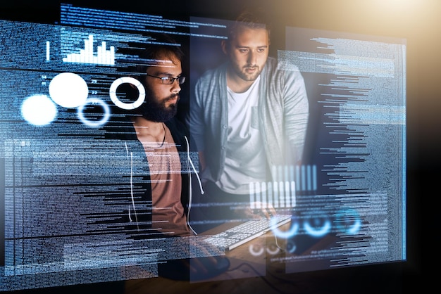 Two of the very best Cropped shot of young computer programmers working on source code