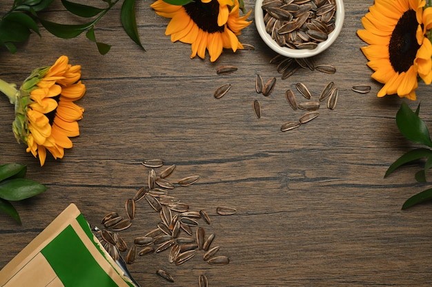 Two view of sunflower seeds and flowers on rustic wooden table Healthy eating and snacks concept