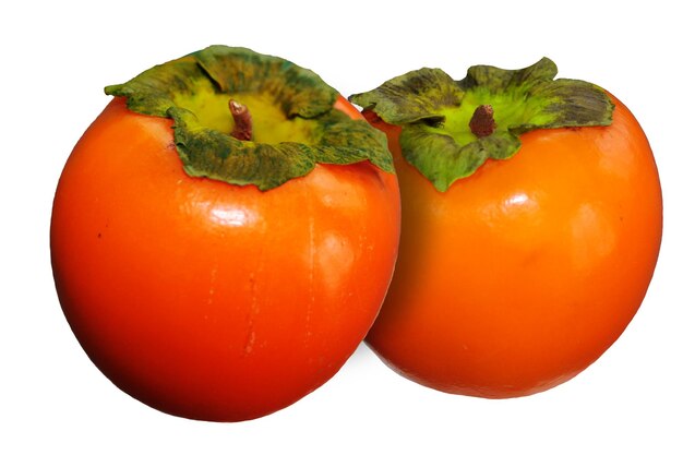 Two vitamin fruits persimmon flaunts on an isolated white background