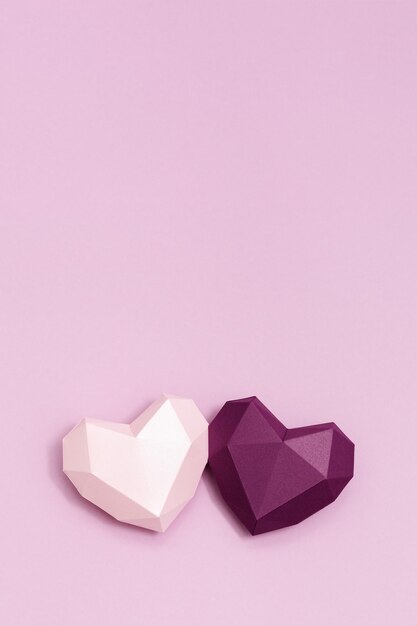 Two volumetric paper hearts purple and pink colored Greeting card or invitation for wedding cards