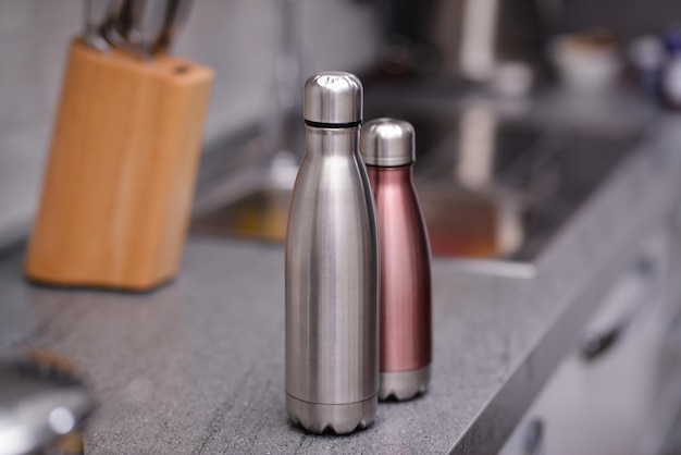 Two Water bottles on kitchen table