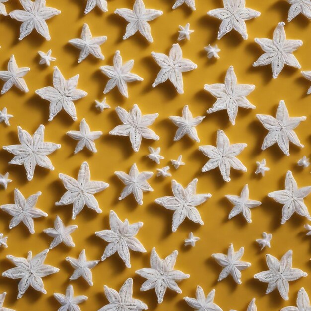 Two white crocheted star pattern on a yellow background