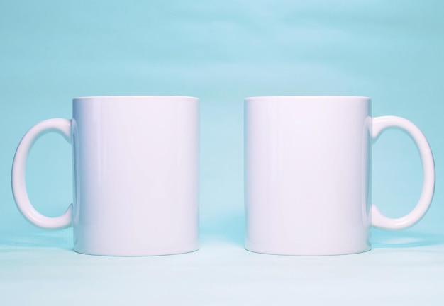 Two white mugs with the word coffee on them