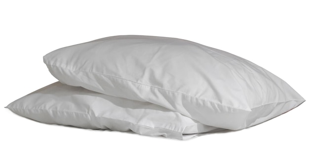 Two white pillows with cases after guest's use at hotel or resor