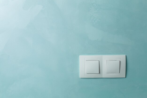 two white sockets on a wall indoor close up