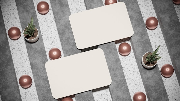 Two white square labels with brown balls on a gray and white striped floor.