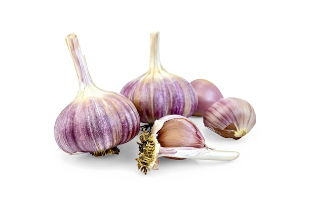 Two whole bulbs of garlic, three garlic clove isolated  