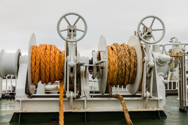 Two winches with orange rope on a ferry