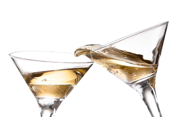 Two wine swirling in a goblet martini glass, isolated on a white background