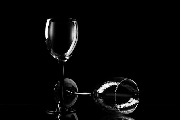 Two wineglasses on the dark background