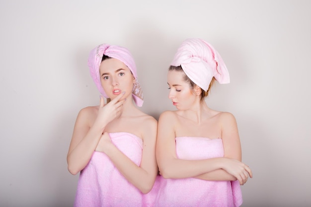 Two woman with a towel on her head