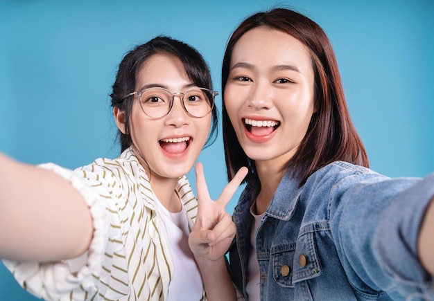 Two women on blue background