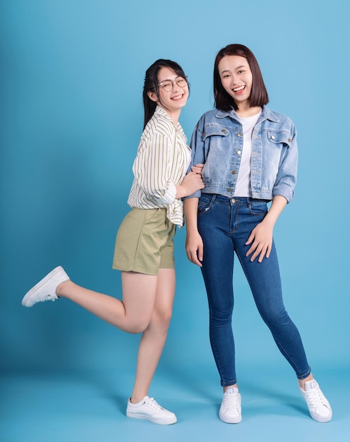 Two women on blue background